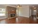 Cozy living room with a stone fireplace and hardwood floors at 3112 Patriot Sw Sq, Marietta, GA 30064
