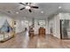 Spacious living room with hardwood floors, crown molding, and natural light from the windows at 3112 Patriot Sw Sq, Marietta, GA 30064