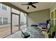 Relax on the screened porch with a ceiling fan, table and chairs, perfect for outdoor dining and entertaining at 3112 Patriot Sw Sq, Marietta, GA 30064