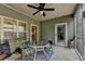 This screened porch with ceiling fan provides access to both the exterior and the home's interior at 3112 Patriot Sw Sq, Marietta, GA 30064
