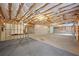 Spacious unfinished basement with visible framing, concrete floor, and exposed ceiling insulation at 554 Grand Ashbury Ln, Sugar Hill, GA 30518