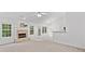 A bright living room featuring a fireplace, and white trim at 554 Grand Ashbury Ln, Sugar Hill, GA 30518