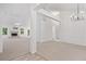 A spacious living room with carpet, fireplace and white trim at 554 Grand Ashbury Ln, Sugar Hill, GA 30518