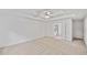 Large main bedroom with neutral carpet, ceiling fan, and large windows at 554 Grand Ashbury Ln, Sugar Hill, GA 30518