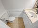Cozy half-bathroom with beadboard accents, new vanity, and tiled floors at 688 Anderson Walk, Marietta, GA 30062