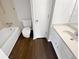 Clean bathroom with white fixtures, vinyl flooring, and ample counter space at 688 Anderson Walk, Marietta, GA 30062