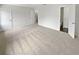 Bedroom with neutral carpet and multiple doorways, offering ample space and flexibility at 688 Anderson Walk, Marietta, GA 30062