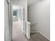 Hallway with carpeted stairs and open doorway to a bright room with a window at 688 Anderson Walk, Marietta, GA 30062