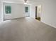Spacious main bedroom featuring neutral carpet, two windows for natural light, and ensuite bathroom at 688 Anderson Walk, Marietta, GA 30062