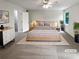 Bright main bedroom featuring neutral walls and soft carpet. (Virtually staged) at 688 Anderson Walk, Marietta, GA 30062