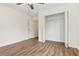 A bedroom features hardwood floors, modern ceiling fan, and walk-in closet at 179 Oakville Dr, Dallas, GA 30157
