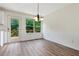 Bright dining room with hardwood floors and a view of the backyard deck at 179 Oakville Dr, Dallas, GA 30157