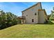 Two-story home showcasing the back exterior with a deck, patio, and landscaped yard at 179 Oakville Dr, Dallas, GA 30157