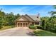 Charming home with a stone-accented facade, manicured lawn, and attached two-car garage at 179 Oakville Dr, Dallas, GA 30157