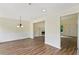 View of the formal dining room connected to the living room with a fireplace at 179 Oakville Dr, Dallas, GA 30157