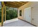 Covered back patio offering a cool, shaded retreat with backyard access at 179 Oakville Dr, Dallas, GA 30157
