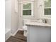 Bathroom features modern granite vanity and bath with bright natural light at 1955 Vicki Se Ln, Atlanta, GA 30316