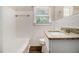 Bathroom featuring a granite counter top, and a tub with white tile at 1955 Vicki Se Ln, Atlanta, GA 30316