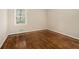 Cozy bedroom with hardwood floors and a bright window view at 1955 Vicki Se Ln, Atlanta, GA 30316