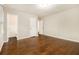 Bedroom with hardwood floors, neutral walls, two closets, and a ceiling light at 1955 Vicki Se Ln, Atlanta, GA 30316