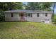 Charming brick home with a well-maintained lawn and inviting red front door at 1955 Vicki Se Ln, Atlanta, GA 30316