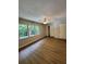 Bedroom with hardwood floors, ceiling fan, closet, and bright windows at 2435 Northlake Ct, Atlanta, GA 30345