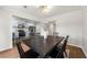 Open concept dining room shows the eat-in kitchen with stainless steel appliances and light blue cabinets at 2435 Northlake Ct, Atlanta, GA 30345