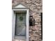 Charming front door with classic brick, traditional address plaque and wreath at 2435 Northlake Ct, Atlanta, GA 30345