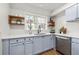 Modern kitchen with blue cabinets, stainless steel appliances, quartz countertops, and an undermount sink at 2435 Northlake Ct, Atlanta, GA 30345