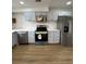 Modern kitchen featuring stainless steel appliances and light blue cabinets at 2435 Northlake Ct, Atlanta, GA 30345