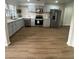 Bright kitchen featuring stainless steel appliances, white countertops, soft-blue painted cabinets, and wood flooring at 2435 Northlake Ct, Atlanta, GA 30345