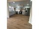 Open kitchen with stainless steel appliances, wood flooring, white countertops, and soft-blue painted cabinets at 2435 Northlake Ct, Atlanta, GA 30345