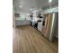 Spacious kitchen with stainless steel appliances, white countertops, soft-blue painted cabinets, and wood flooring at 2435 Northlake Ct, Atlanta, GA 30345