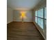 Sun-filled living room with large windows and updated flooring, creating a warm and inviting atmosphere at 2435 Northlake Ct, Atlanta, GA 30345