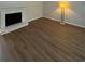 Bright living room with hardwood laminate flooring and a vintage fireplace at 2435 Northlake Ct, Atlanta, GA 30345
