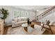 Comfortable living room boasts hardwood floors, a bright window, and neutral furniture in neutral colors at 2435 Northlake Ct, Atlanta, GA 30345