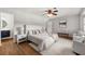 Bright main bedroom with a ceiling fan and adjacent bathroom at 2435 Northlake Ct, Atlanta, GA 30345