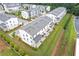 Bird's eye view of townhomes with a grey roof, and luscious greenery at 2808 Maddison Towns Ave, Norcross, GA 30071
