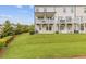 Spacious backyard featuring two decks, a lawn, and beautiful mature landscaping at 2808 Maddison Towns Ave, Norcross, GA 30071