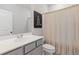 Clean bathroom with white cabinets, a single sink and shower curtain at 2808 Maddison Towns Ave, Norcross, GA 30071