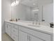 The bathroom has double sink vanity with lots of counter space and bright lighting at 2808 Maddison Towns Ave, Norcross, GA 30071