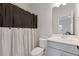 Cozy bathroom with combo shower and tub, vanity, and neutral tones at 2808 Maddison Towns Ave, Norcross, GA 30071