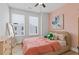 Comfortable bedroom with windows, a large mirror, and a cozy bed at 2808 Maddison Towns Ave, Norcross, GA 30071