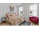 Cozy bedroom with natural light, neutral decor, and comfortable furnishings at 2808 Maddison Towns Ave, Norcross, GA 30071