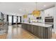Bright, open kitchen with a large island, stainless steel appliances, and stylish pendant lighting at 2808 Maddison Towns Ave, Norcross, GA 30071