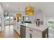 Spacious kitchen island with a sink, dishwasher, and white countertops, perfect for meal prep and entertaining at 2808 Maddison Towns Ave, Norcross, GA 30071