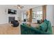 Elegant living room with fireplace, modern furniture, and plenty of natural light at 2808 Maddison Towns Ave, Norcross, GA 30071