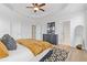 This main bedroom boasts a tray ceiling, modern rug, and light-filled ambiance at 2808 Maddison Towns Ave, Norcross, GA 30071