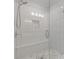 Step into this modern shower, featuring elegant white tile and a built-in bench at 2808 Maddison Towns Ave, Norcross, GA 30071