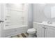 Clean, all-white bathroom with modern fixtures, vanity, and tub with shower at 3175 Dogwood Dr, Atlanta, GA 30354